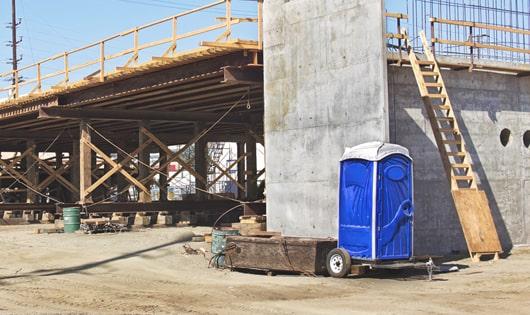 easily accessible portable restrooms at a construction site, saving workers from long walks to a permanent restroom